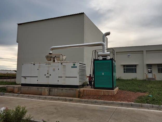 Retrofit Emission Control Device installed on a diesel genset exhaust