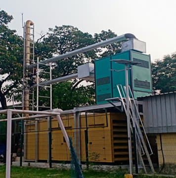 Outdoor diesel generator installation with acoustic enclosure